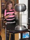 CPS student experiences electrifying effect of Van de Graaff generator.